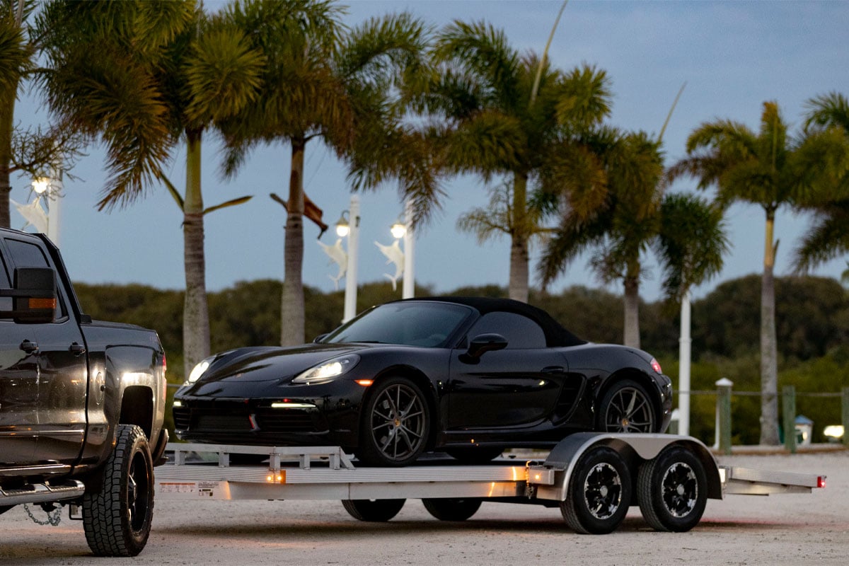 Black Car Loaded On Polaris Open Car Hauler